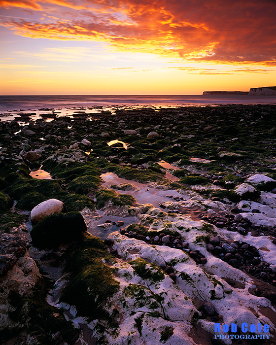 The chalk bedrock platform catches the reflected light of the sky shortly after sunset at Birling Gap