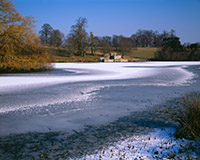 A light dusting of snow lies on the frozen Upper Pond in Petworth Park