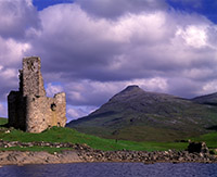 Ardvreck Castle and Quinag shortly after a summer sunrise